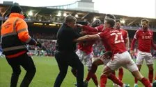 During court storm: fan headbutts opposing player