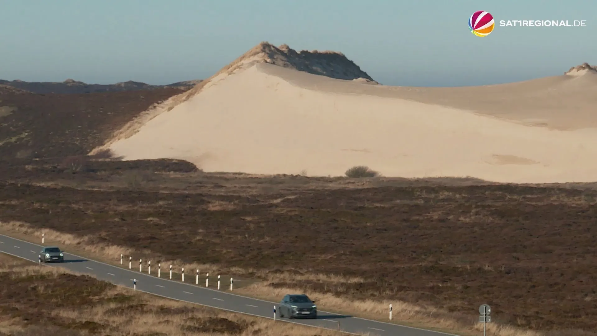 Shifting sand dune on Sylt threatens to bury road under itself