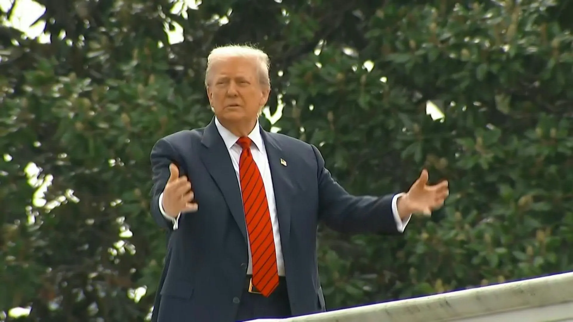 Trump surveys White House grounds from rooftop