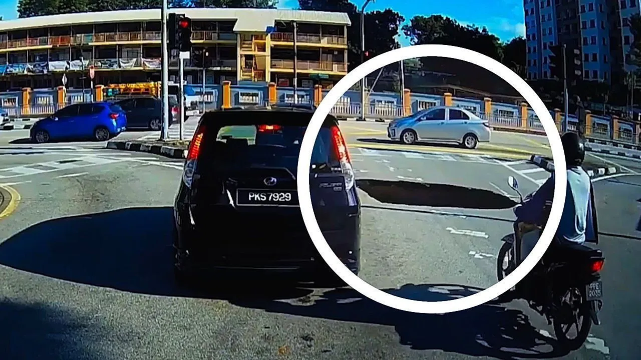 Sinkhole suddenly opens beside car in Malaysia