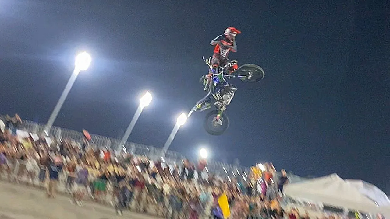 Freestyle motocross rider saves himself after bike malfunctions going up ramp