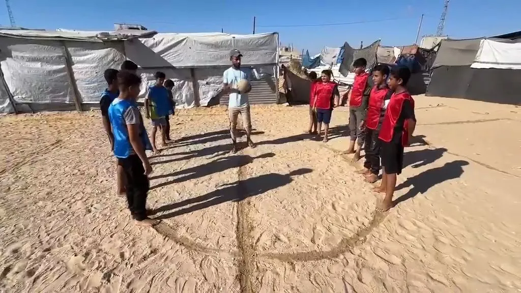 Gaza children play their own 'World Cup' at stadium-turned shelter