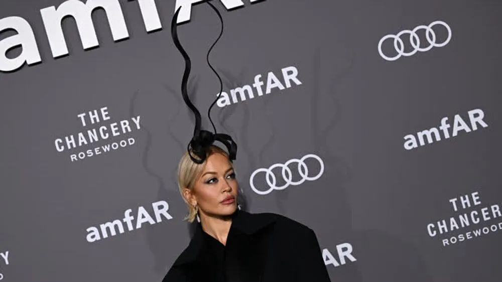 Rita Ora surprises at amfAR Gala with extravagant headpiece