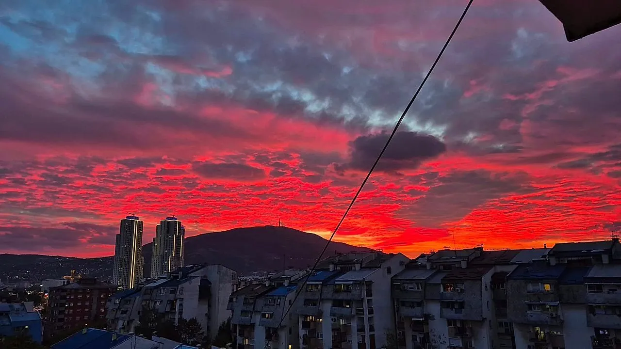 Vivid pink and orange sunset paints the sky above Macedonia in stunning display