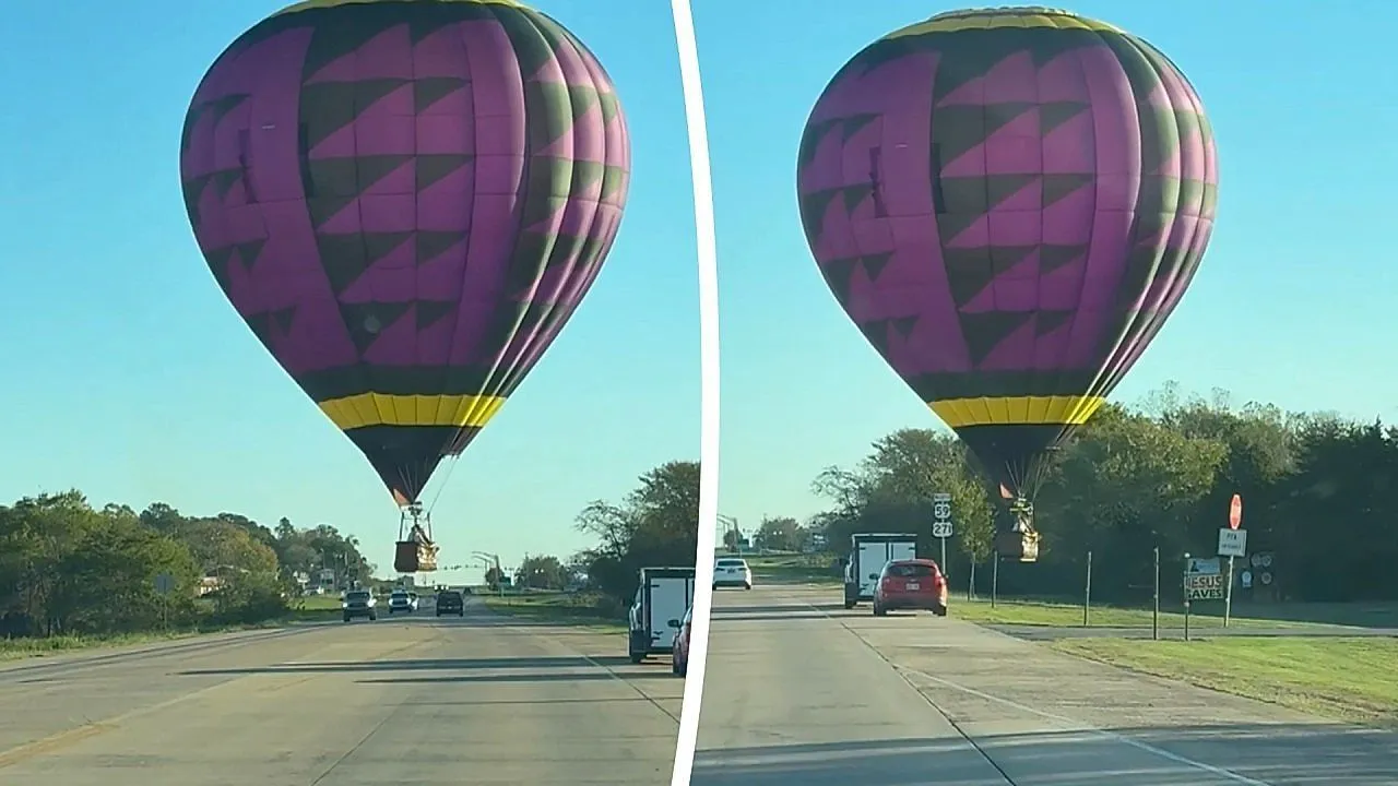 Hot air balloon floats over Oklahoma highway just feet above passing cars